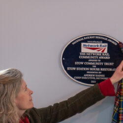 Jo Noble of Network Rail unveiling Network Rail Community Award plaque